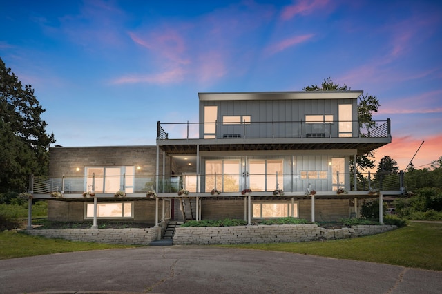 48002 Ridge Rd, New Buffalo, MI 49117 - view of front facade featuring a balcony and board and batten siding