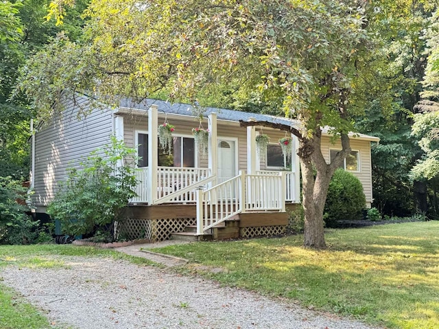 285 Brookside Dr, Ann Arbor, MI 48105 - view of front of house featuring a front yard and covered porch