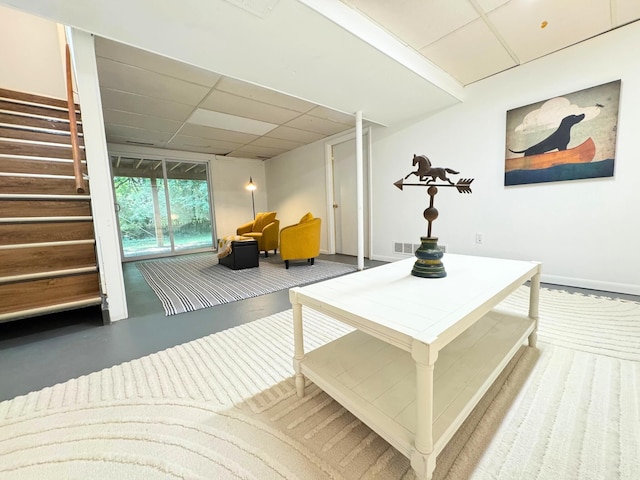 285 Brookside Dr, Ann Arbor, MI 48105 - living room featuring a drop ceiling and stairway