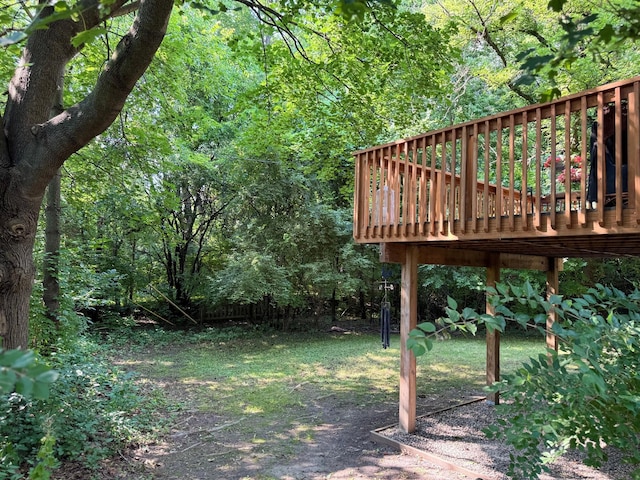 285 Brookside Dr, Ann Arbor, MI 48105 - view of yard featuring a deck and a view of trees