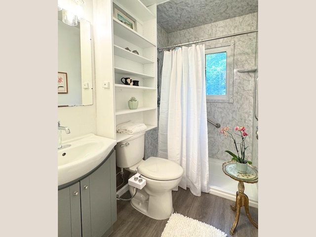 285 Brookside Dr, Ann Arbor, MI 48105 - full bath with wood finished floors, vanity, and a shower with shower curtain
