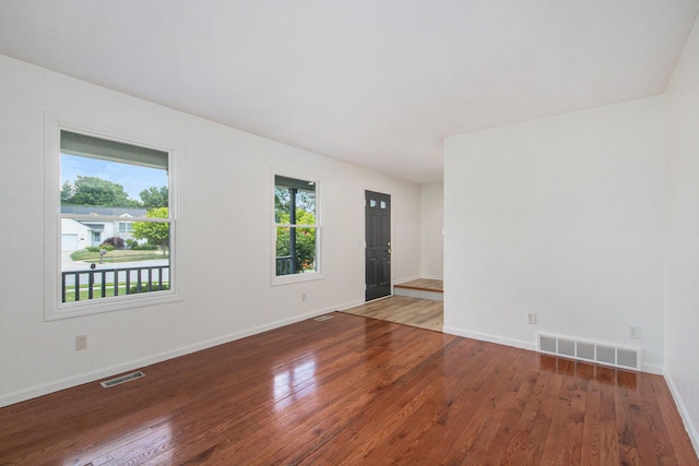 1882 Whistle Stop Dr SE, Grand Rapids, MI 49508 - empty room with hardwood / wood-style floors and healthy amount of natural light