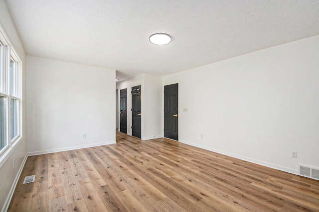 1882 Whistle Stop Dr SE, Grand Rapids, MI 49508 - unfurnished room with light wood finished floors and plenty of natural light