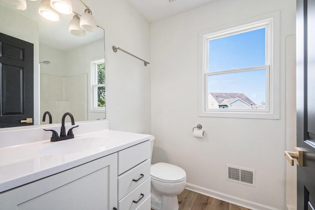 1882 Whistle Stop Dr SE, Grand Rapids, MI 49508 - full bathroom with wood finished floors, vanity, and a shower