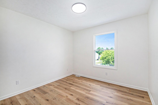 1882 Whistle Stop Dr SE, Grand Rapids, MI 49508 - spare room with light wood finished floors