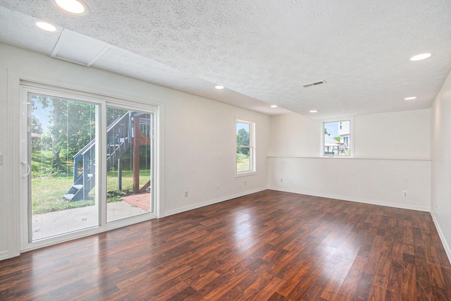 1882 Whistle Stop Dr SE, Grand Rapids, MI 49508 - spare room featuring plenty of natural light, wood finished floors, a textured ceiling, and recessed lighting