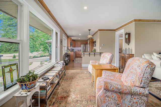 6667 W River Rd NE, Belmont, MI 49306 - living room with crown molding, light wood-style floors, and recessed lighting