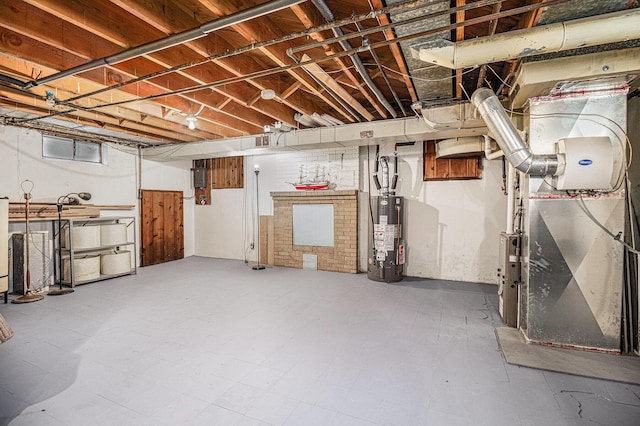 6667 W River Rd NE, Belmont, MI 49306 - unfinished basement with gas water heater, heating unit, and tile patterned floors