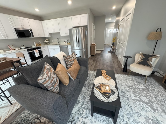 891 Rex St, Fremont, MI 49412 - living room with dark wood-style floors and recessed lighting