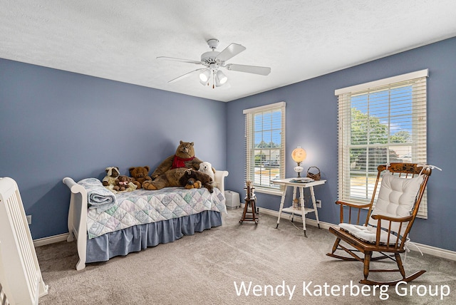 1033 Lumina Dr, Jenison, MI 49428 - bedroom with carpet floors, ceiling fan, and a textured ceiling
