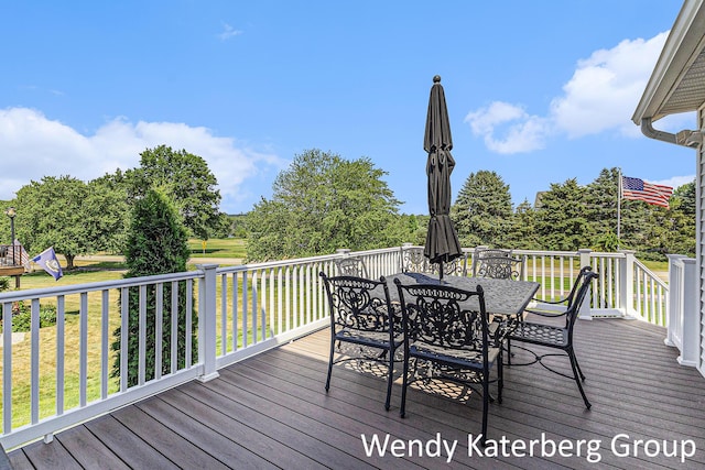 1033 Lumina Dr, Jenison, MI 49428 - deck featuring outdoor dining area and a lawn