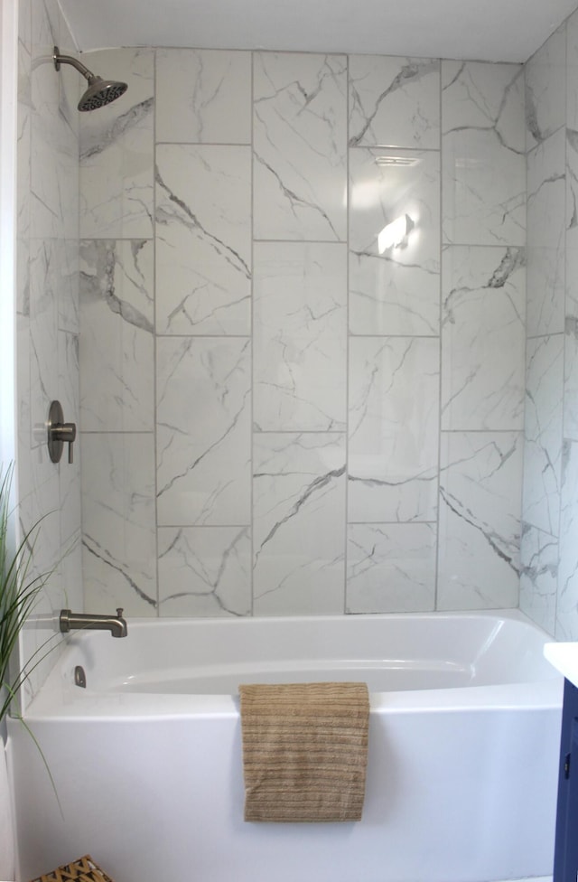 1608 S Rose St, Kalamazoo, MI 49001 - bathroom featuring washtub / shower combination and vanity