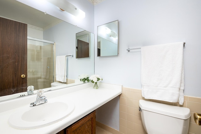 2623 Meade Ct, Ann Arbor, MI 48105 - full bath with a shower stall, vanity, wainscoting, and tile walls
