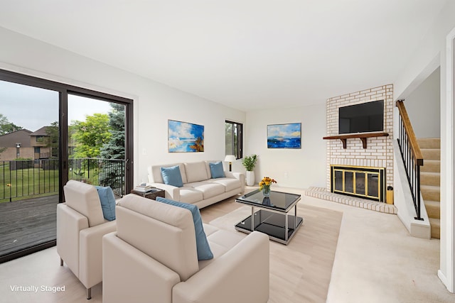 2623 Meade Ct, Ann Arbor, MI 48105 - living room featuring a fireplace and stairway