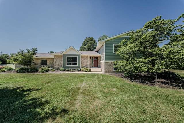 7532 Dell Rd, Saline, MI 48176 - split level home featuring brick siding and a front yard