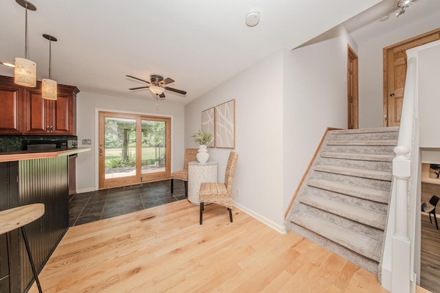 7532 Dell Rd, Saline, MI 48176 - unfurnished room featuring ceiling fan, stairway, and wood finished floors