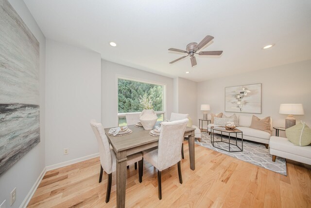 7532 Dell Rd, Saline, MI 48176 - dining area featuring light wood-type flooring, a ceiling fan, and recessed lighting