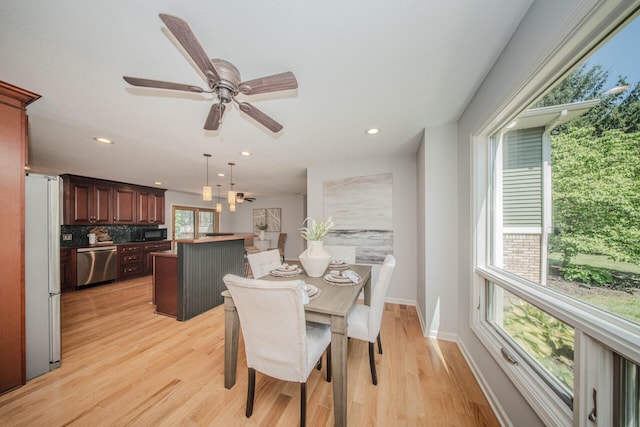 7532 Dell Rd, Saline, MI 48176 - dining room with light wood-type flooring, recessed lighting, and ceiling fan