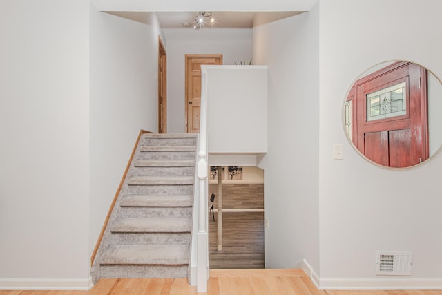 7532 Dell Rd, Saline, MI 48176 - stairs with baseboards and wood finished floors