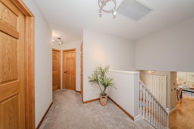 7532 Dell Rd, Saline, MI 48176 - hallway featuring an upstairs landing and light colored carpet