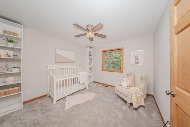 7532 Dell Rd, Saline, MI 48176 - bedroom with carpet, a ceiling fan, and a nursery area