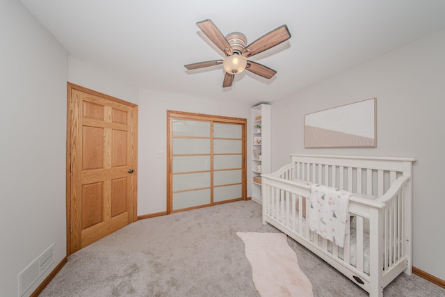 7532 Dell Rd, Saline, MI 48176 - carpeted bedroom featuring a ceiling fan, a closet, and a nursery area