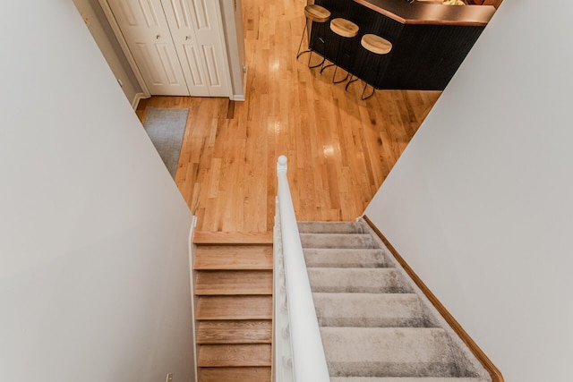 7532 Dell Rd, Saline, MI 48176 - stairs featuring wood finished floors and baseboards