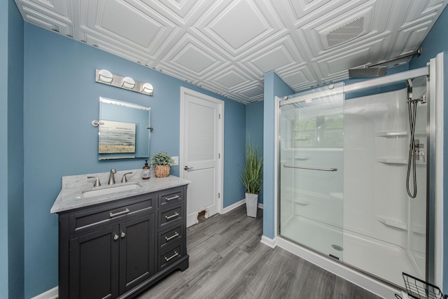 7532 Dell Rd, Saline, MI 48176 - full bath featuring a shower stall, vanity, an ornate ceiling, and wood finished floors