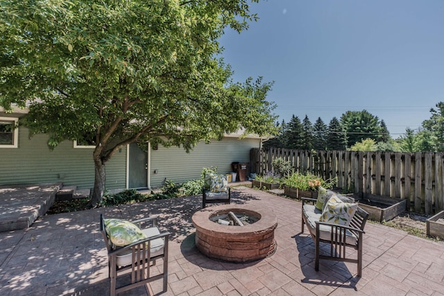 7532 Dell Rd, Saline, MI 48176 - view of patio featuring an outdoor fire pit