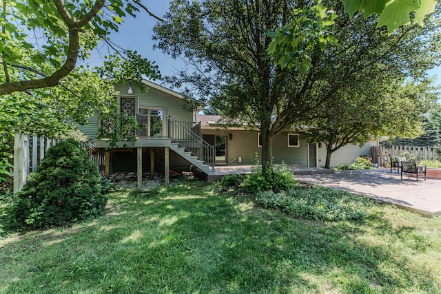 7532 Dell Rd, Saline, MI 48176 - rear view of house with stairway, a patio, and a deck