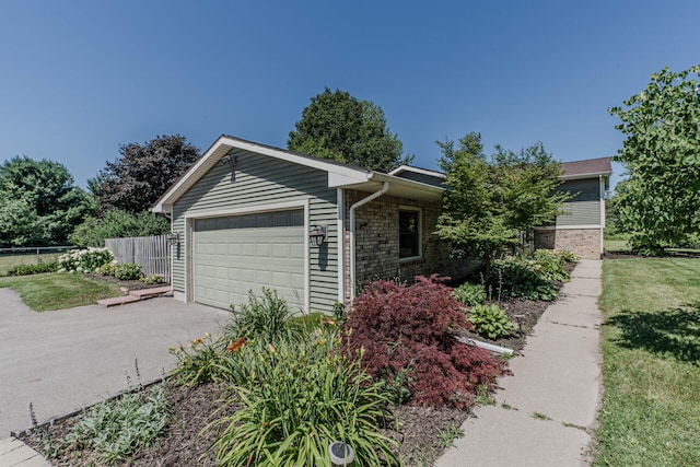 7532 Dell Rd, Saline, MI 48176 - view of front of house featuring a garage, driveway, and brick siding