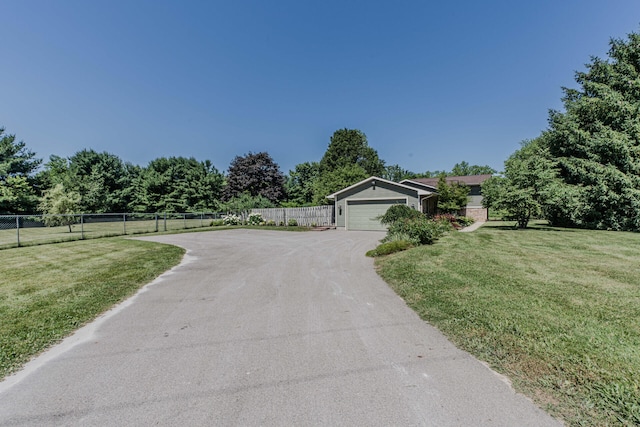7532 Dell Rd, Saline, MI 48176 - view of front of house with asphalt driveway and a garage