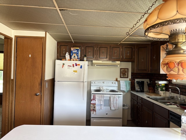 22347 5 Mile Rd, Morley, MI 49336 - kitchen with white appliances, extractor fan, light countertops, and dark brown cabinetry