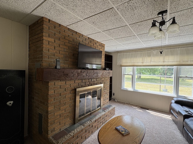 22347 5 Mile Rd, Morley, MI 49336 - living room with carpet, a paneled ceiling, and a fireplace