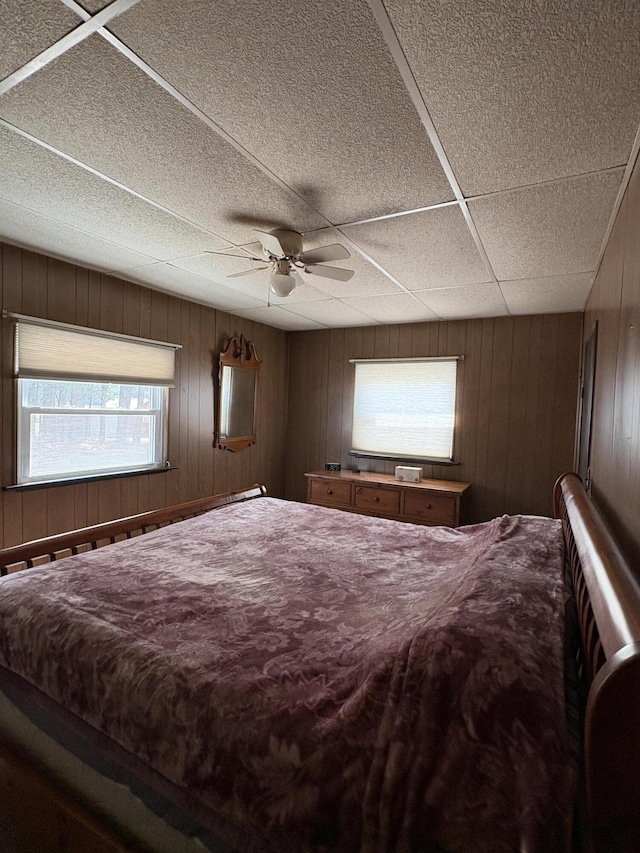 22347 5 Mile Rd, Morley, MI 49336 - bedroom featuring wooden walls and ceiling fan