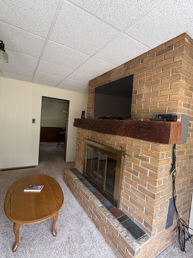 22347 5 Mile Rd, Morley, MI 49336 - carpeted living area featuring a drop ceiling and a fireplace