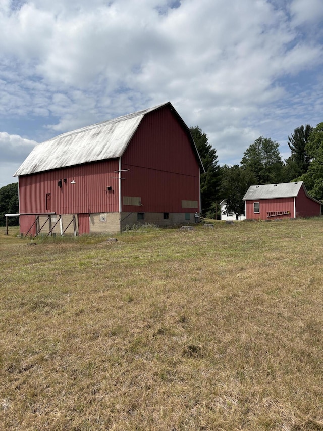 22347 5 Mile Rd, Morley, MI 49336 - view of barn featuring a lawn