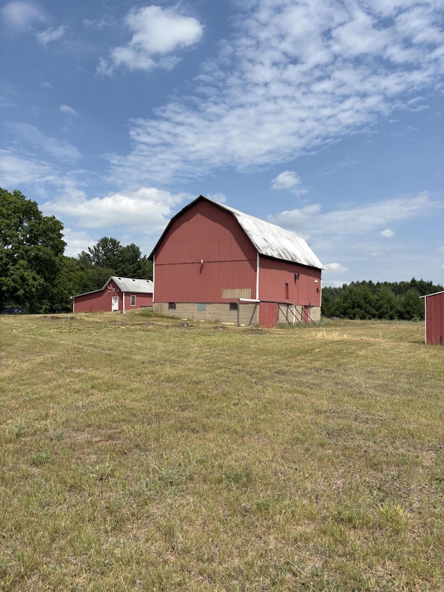 22347 5 Mile Rd, Morley, MI 49336 - view of green lawn with a barn and an outbuilding
