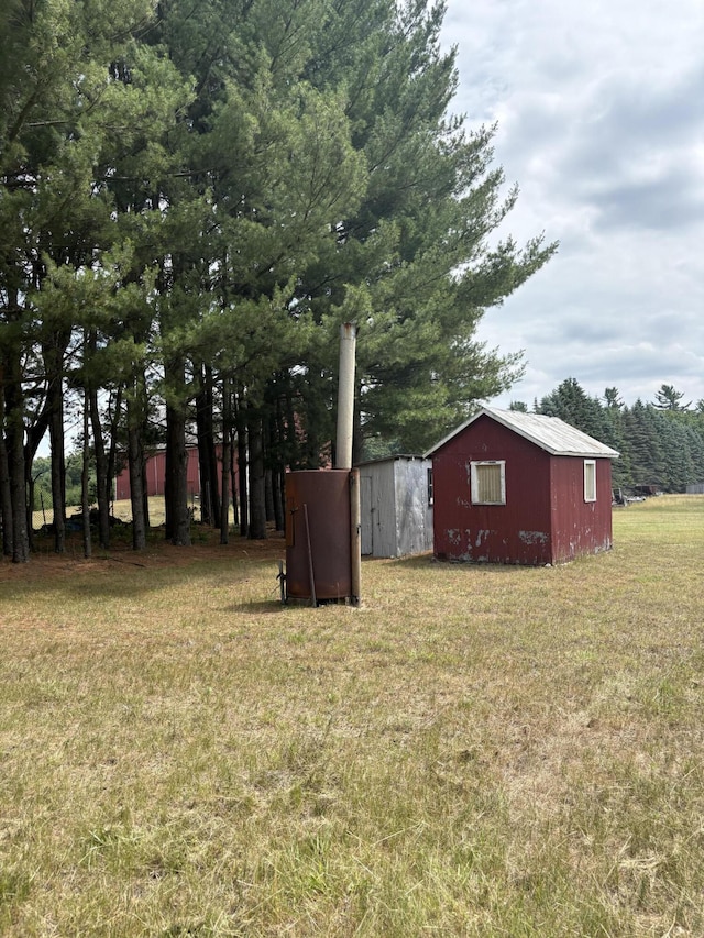 22347 5 Mile Rd, Morley, MI 49336 - view of green lawn with an outbuilding