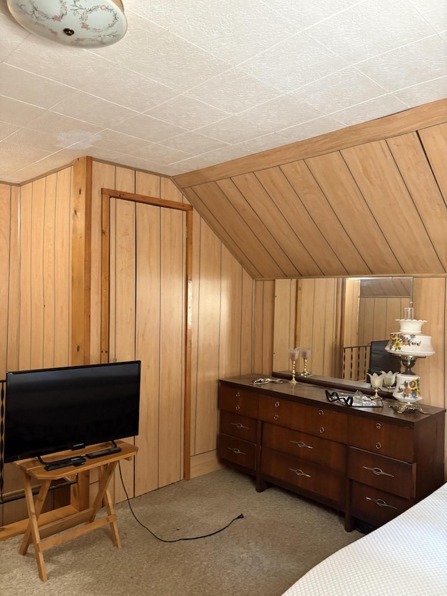 22347 5 Mile Rd, Morley, MI 49336 - bedroom featuring wood walls, vaulted ceiling, and carpet