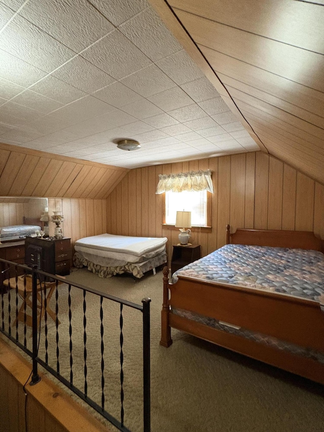 22347 5 Mile Rd, Morley, MI 49336 - bedroom with lofted ceiling, wood walls, and carpet