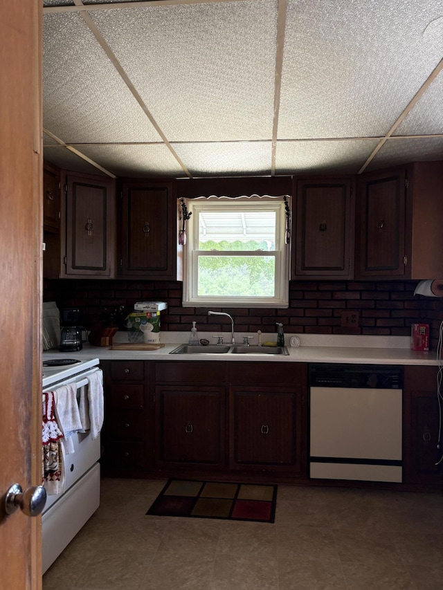 22347 5 Mile Rd, Morley, MI 49336 - kitchen with white appliances, light countertops, a paneled ceiling, dark brown cabinets, and light floors