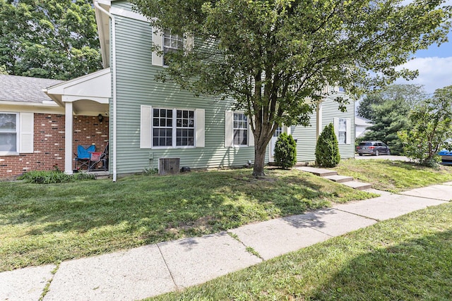 1415 Wingate Blvd, Ypsilanti, MI 48198 - view of front of house featuring a front lawn and brick siding