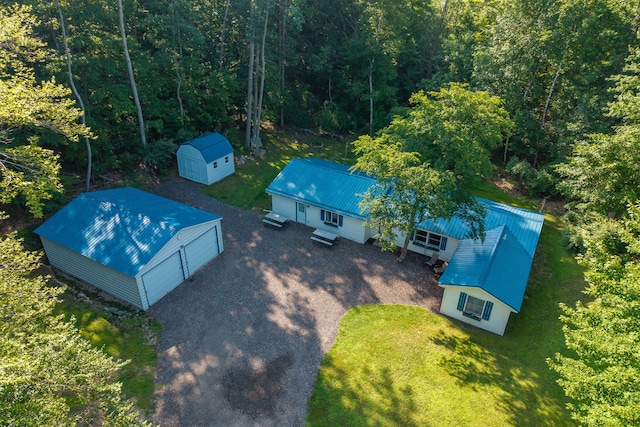 1051 Vallado Dr, Weidman, MI 48893 - view from above of property with a heavily wooded area