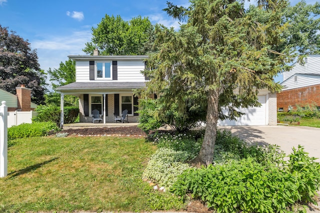 2145 Steeplechase Dr, Ann Arbor, MI 48103 - traditional home featuring brick siding, a porch, concrete driveway, and a chimney