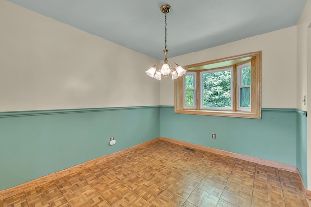 2145 Steeplechase Dr, Ann Arbor, MI 48103 - unfurnished room with a chandelier and baseboards