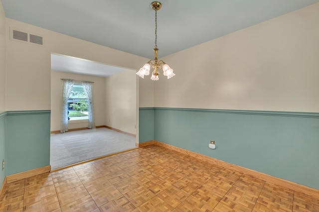 2145 Steeplechase Dr, Ann Arbor, MI 48103 - empty room with baseboards and a chandelier