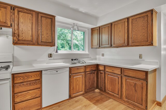 2145 Steeplechase Dr, Ann Arbor, MI 48103 - kitchen featuring white appliances, brown cabinets, and light wood-style flooring