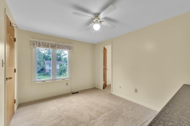 2145 Steeplechase Dr, Ann Arbor, MI 48103 - spare room with a ceiling fan and light carpet