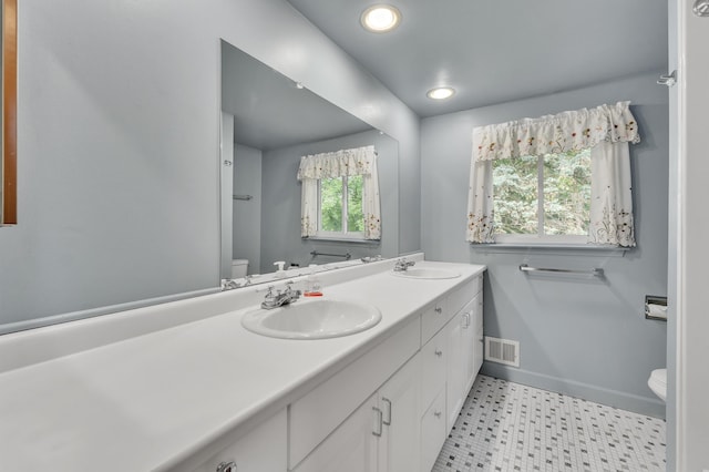 2145 Steeplechase Dr, Ann Arbor, MI 48103 - bathroom featuring double vanity, tile patterned floors, and recessed lighting
